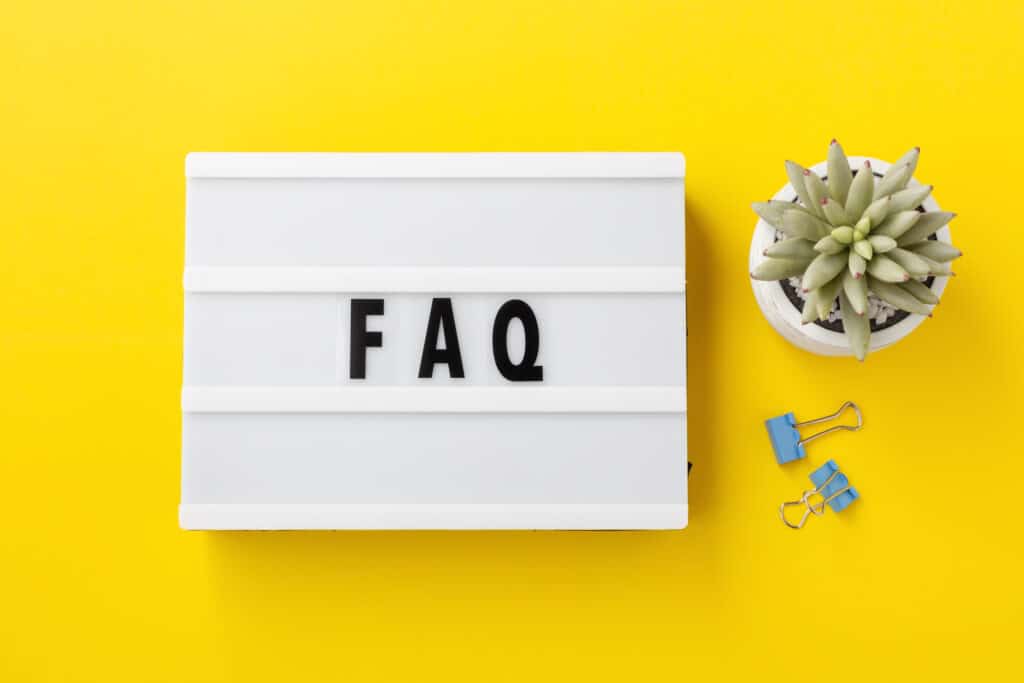 FAQ word on lightbox on yellow background, FAQs for AC Repair in Paradise Valley