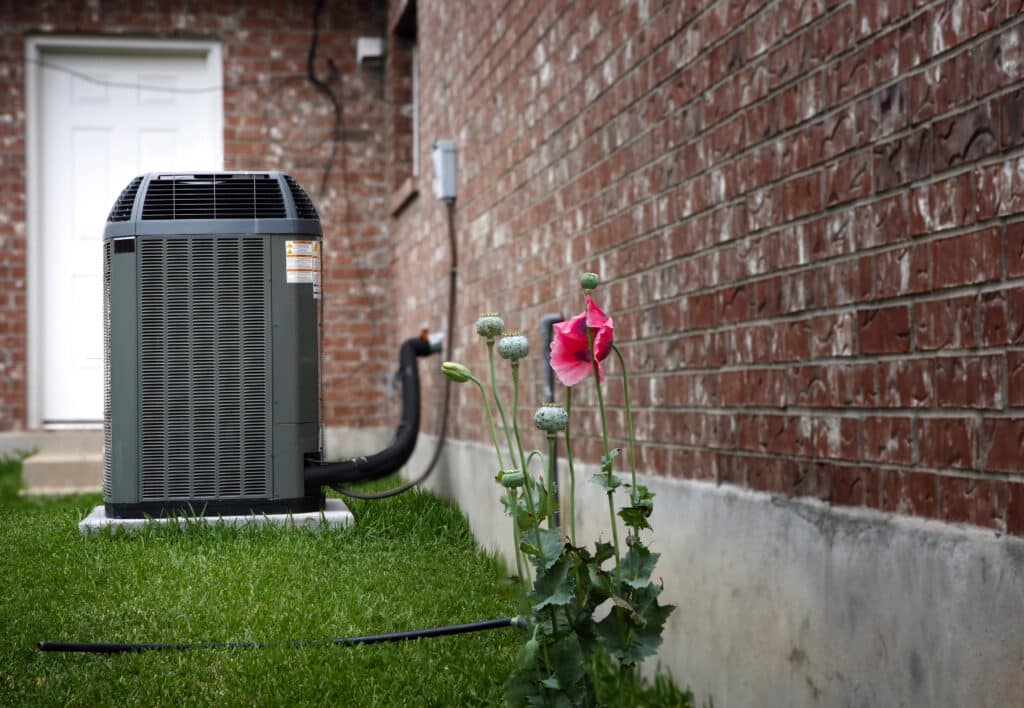 A high-efficiency modern HVAC system provides an energy-saving solution in the backyard