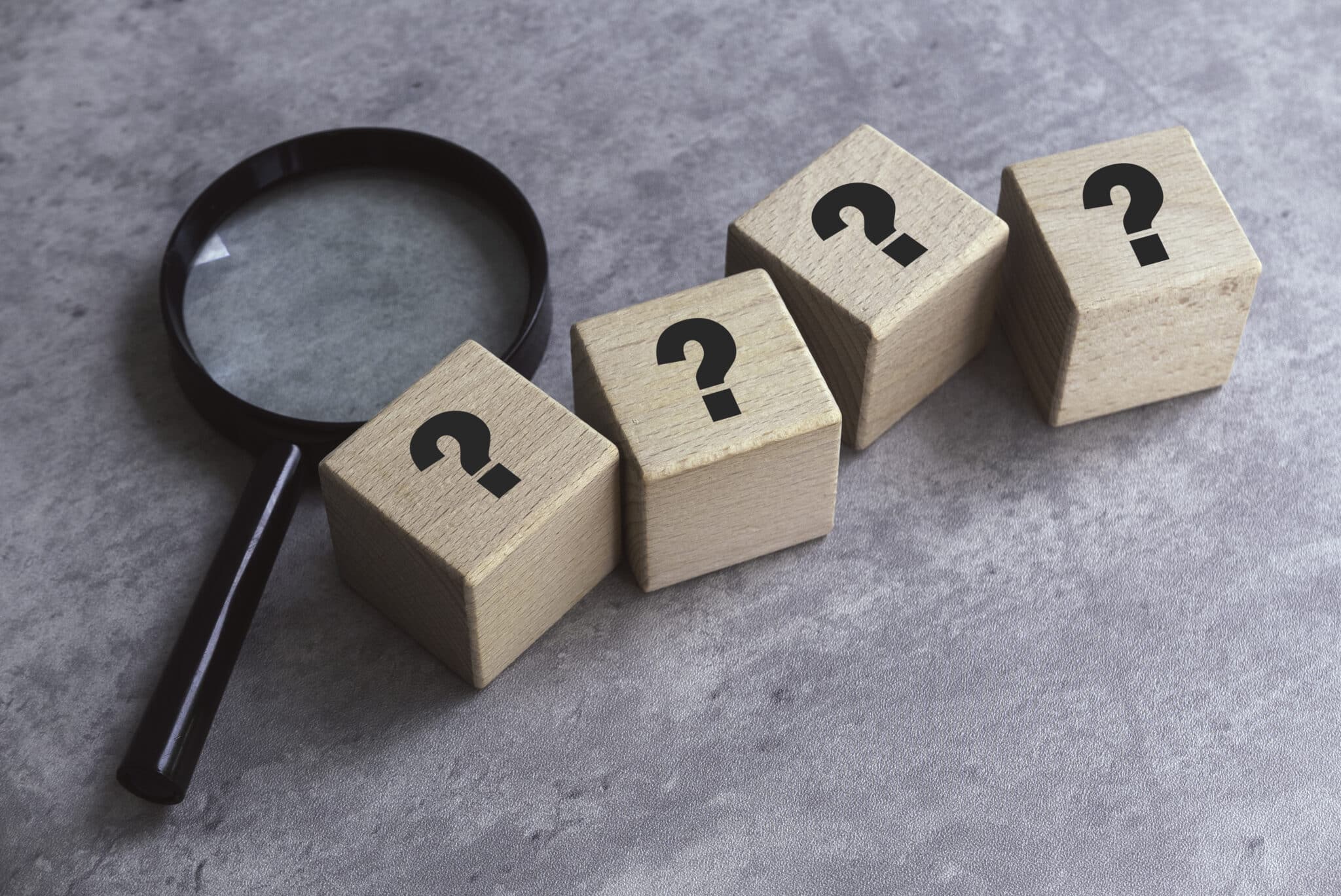  HVAC Considerations Wooden Cube with Question Mark Symbol and magnifying glass.